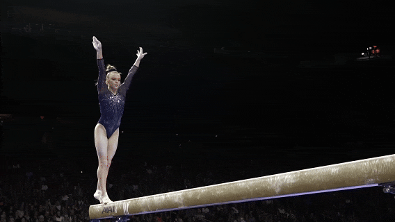 A gymnast flips on a balance beam, cinematic style generated by sora 2