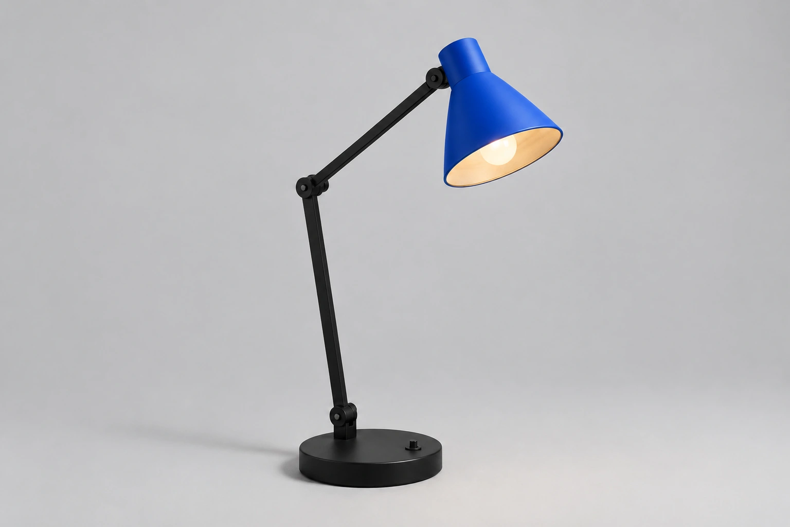 Desk lamp with its shade edited from matte black to cobalt blue